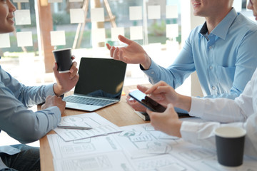 user experience UX designer designing web on smart phone layout. UI developer planning working on mobile application prototype