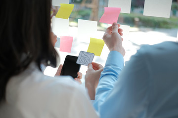 user experience UX designer designing web on smart phone layout. UI developer planning working on mobile application prototype