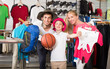 © JackF - Adult parents with boy shopping hiking goods