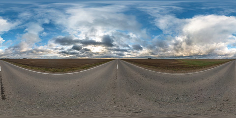 Wall Mural - full seamless spherical hdri panorama 360 degrees angle view on asphalt road among fields in autumn day with beautiful clouds in equirectangular projection, ready for VR AR virtual reality content