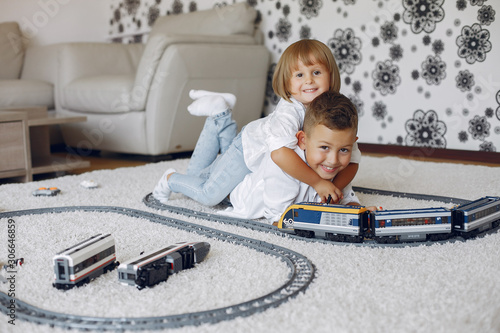 Brother and sister in a playing room. Children playing with a lego. Kids with...
