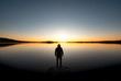 © cppzone - Lonely man silhouette at sunset lake