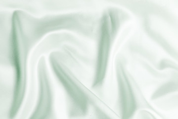 light green silk fabric texture. Satin Background