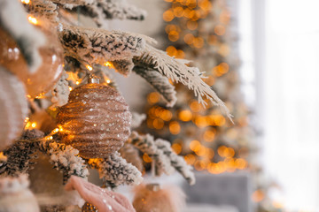 Canvas Print - Christmas tree branch with ball indoors, closeup. Festive interior decoration