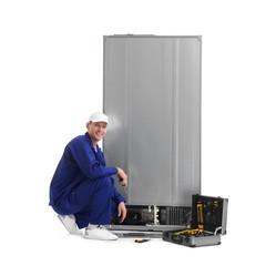 Sticker - Male technician repairing refrigerator on white background