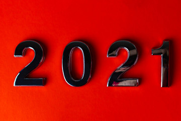 orange background. close-up. the laid out numbers 2021. metallic luster.