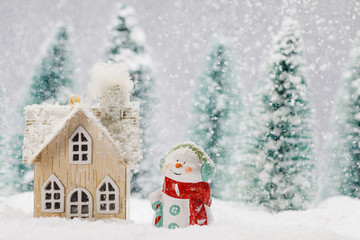 Sticker - Snowman and house in winter