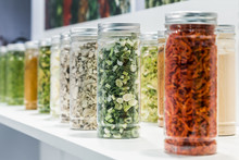 Freeze Dried Vegetables Sliced In Glass Jars In A Shop Window