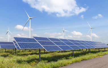 Wall Mural - solar cells or solar panels or photovoltaic cells with wind turbines generating electricity alternat