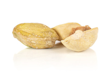 Wall Mural - Group of one whole two pieces of salted pistachio isolated on white background