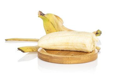 Wall Mural - Group of one half one piece of open sweet yellow banana on round bamboo coaster isolated on white background