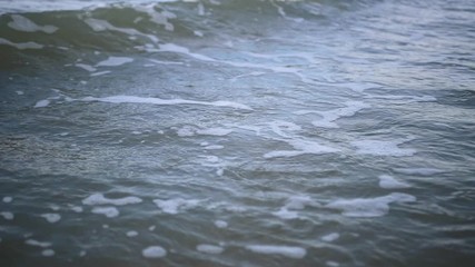 Wall Mural - Waves crashing the beach in sunny day