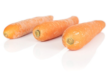 Poster - Group of three whole bright fresh orange carrot isolated on white background