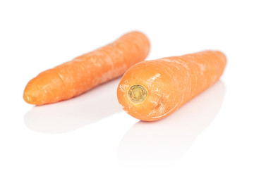 Group of two whole bright fresh orange carrot isolated on white background