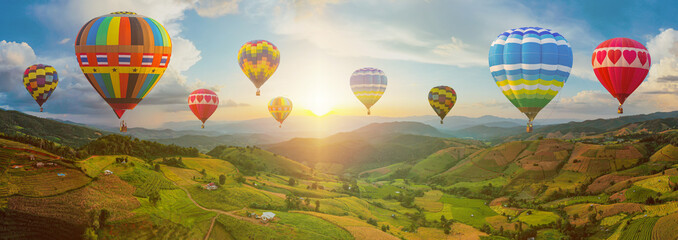 Wall Mural - Colorful Hot Air Balloons. Aerial view Sunset scene of Pa Bong Piang terraced rice fields, Mae Chaem, Chiang Mai Thailand