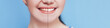 Smiling woman with before and after teeth whitening, Photo deveded two parts. Blue background.