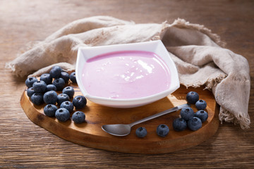 Wall Mural - bowl of blueberry yogurt with fresh berries