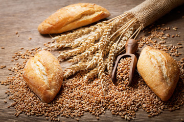 Wall Mural - fresh bread with wheat ears and grains