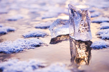 Ice On The Frozen Lake At Sunset. Macro Image, Shallow Depth Of Field. Winter Nature Background