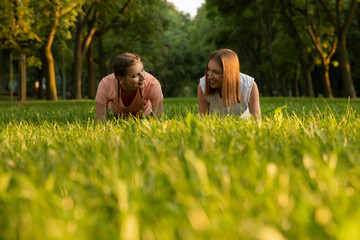 Young girls go in for sports in nature.