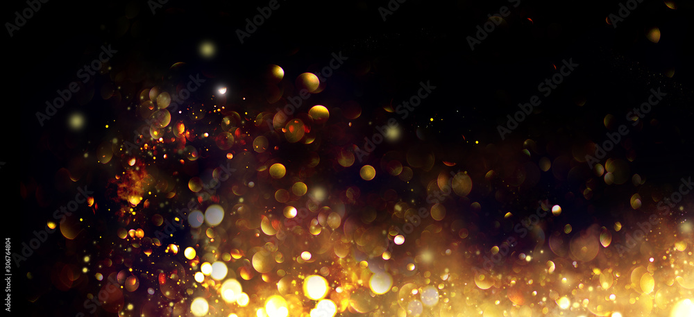 Golden Christmas and New Year glittering stars swirl on black bokeh background, backdrop with sparkling golden stars, holiday garland, magic glowing dust, lights. Gold Abstract Glitter Blinking sparks - obrazy, fototapety, plakaty 