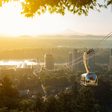 Cable Car In Portland, Oregon, USA With Wonderful View On Sunrise With Mt. Hood And Aerial Tram Going To OHSU