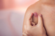 © Aleksej - Woman tries to crush boil on her shoulder. Medicine and skin care concept