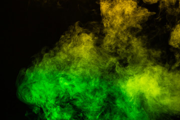 Wall Mural - green and yellow smoke overlay on a black background