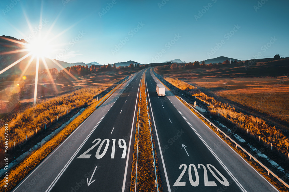 Driving on open road at beautiful sunny day to new year 2020. Aerial view - obrazy, fototapety, plakaty 