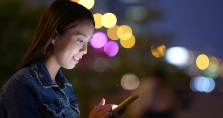 Poster - Woman use of cellphone in city at night