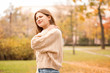 © Pixel-Shot - Young woman suffering from back pain outdoors
