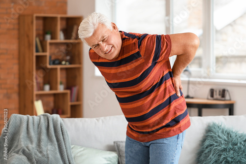 Fotografía Senior man suffering from back pain at home