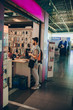 © qunica.com - Man with backpack buying stuff for the trip on the airport