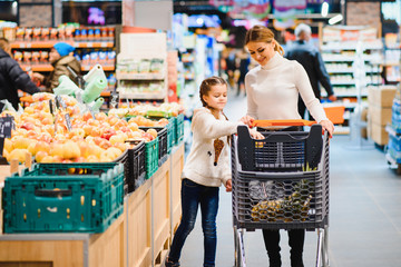 mother with daughter at a grocery store