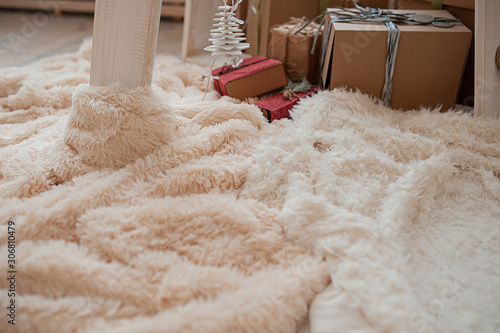 Cuadros en Lienzo cozy fluffy plaid pastel shades on the background of gift boxes