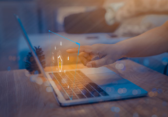 businessman using a laptop computer with technology cybersecurity and privacy concept. protection an
