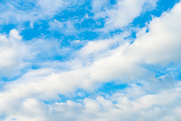 Idylic blue sky with fluffy cloud sunset