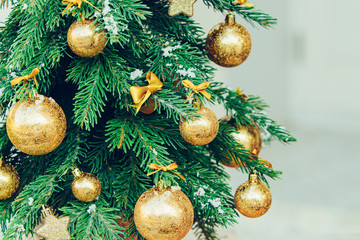 Wall Mural - Green fir tree with golden balls. Christmas wallpaper.
