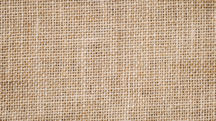 Wall Mural - Cotton woven fabric background with flecks of varying colors of beige and brown. with copy space. office desk concept, Jute hessian sackcloth natura / Hessian sackcloth burlap woven texture background