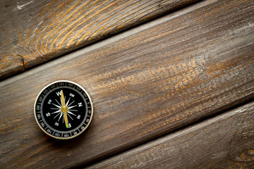 Wall Mural - Compass - small and stylish - on dark wooden background top view copy space