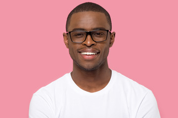 Head shot portrait smiling African American man in glasses