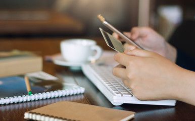 Wall Mural - Businesswoman using mobile phone to payment or shopping online with credit card