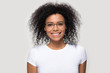 © fizkes - Head shot portrait smiling African American woman wearing glasses