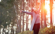 © denisval - happy attractive young woman walks and dance in autumn forest, fashion model