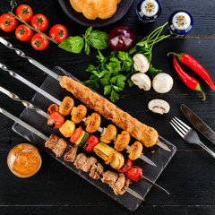 Sticker - shish kebab on a dark wooden background