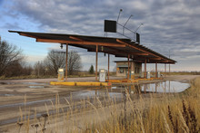 Abandoned Gas Station Against Dramatic Sky