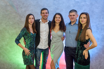 Group of friends posing at celebration of New Year