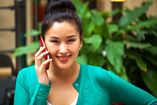 Young Woman Calling By Phone In A Shopping Center