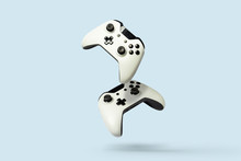 Flying Air Gamepads From A Game Console On A Blue Background. The Concept Of Games, Online Games, E-sports. Levitation