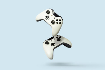 flying air gamepads from a game console on a blue background. the concept of games, online games, e-